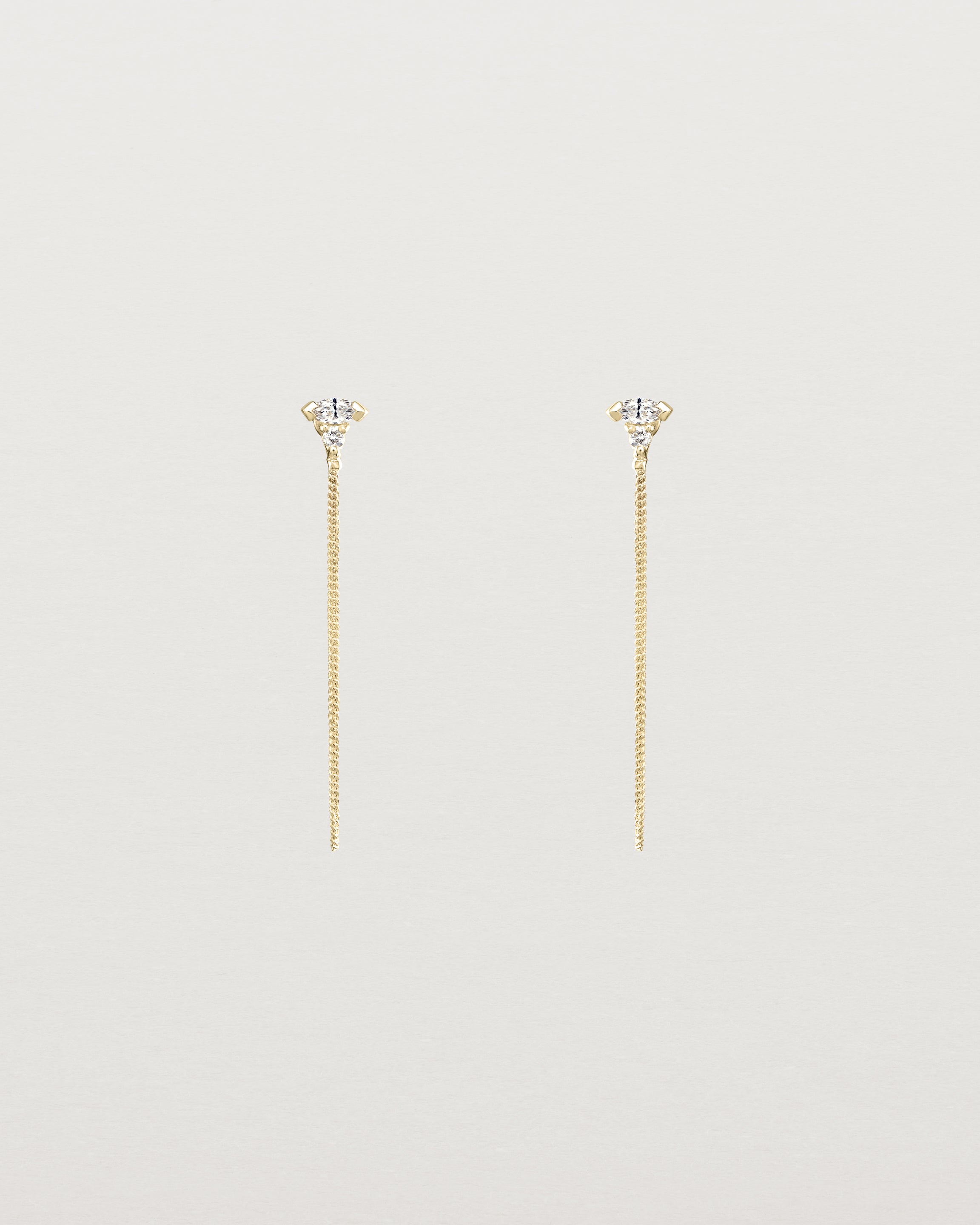 Front view of the Vega Loop Studs | Diamonds in yellow gold.