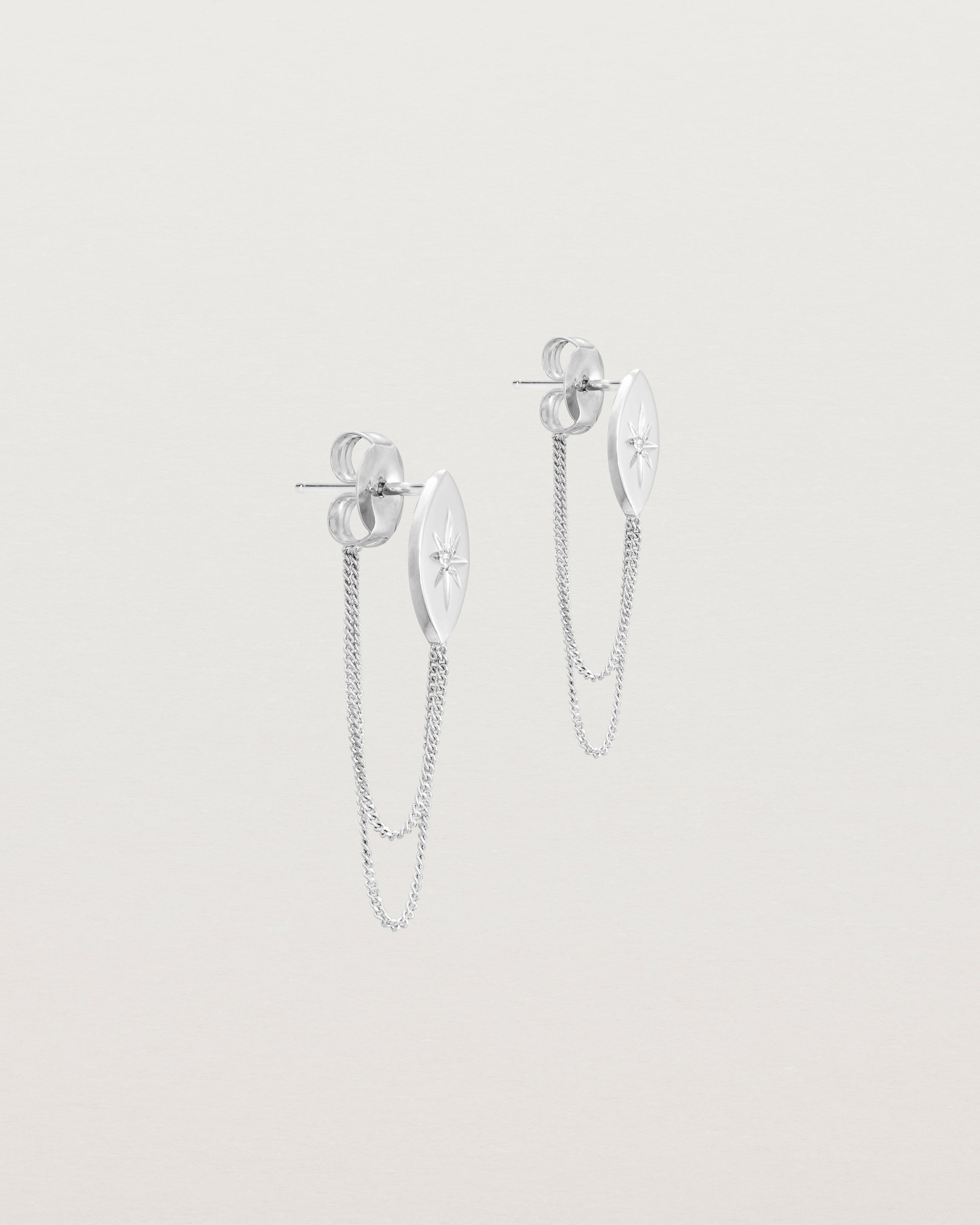 Angled view of the Willow Loop Studs | Birthstone in sterling silver with white diamonds.