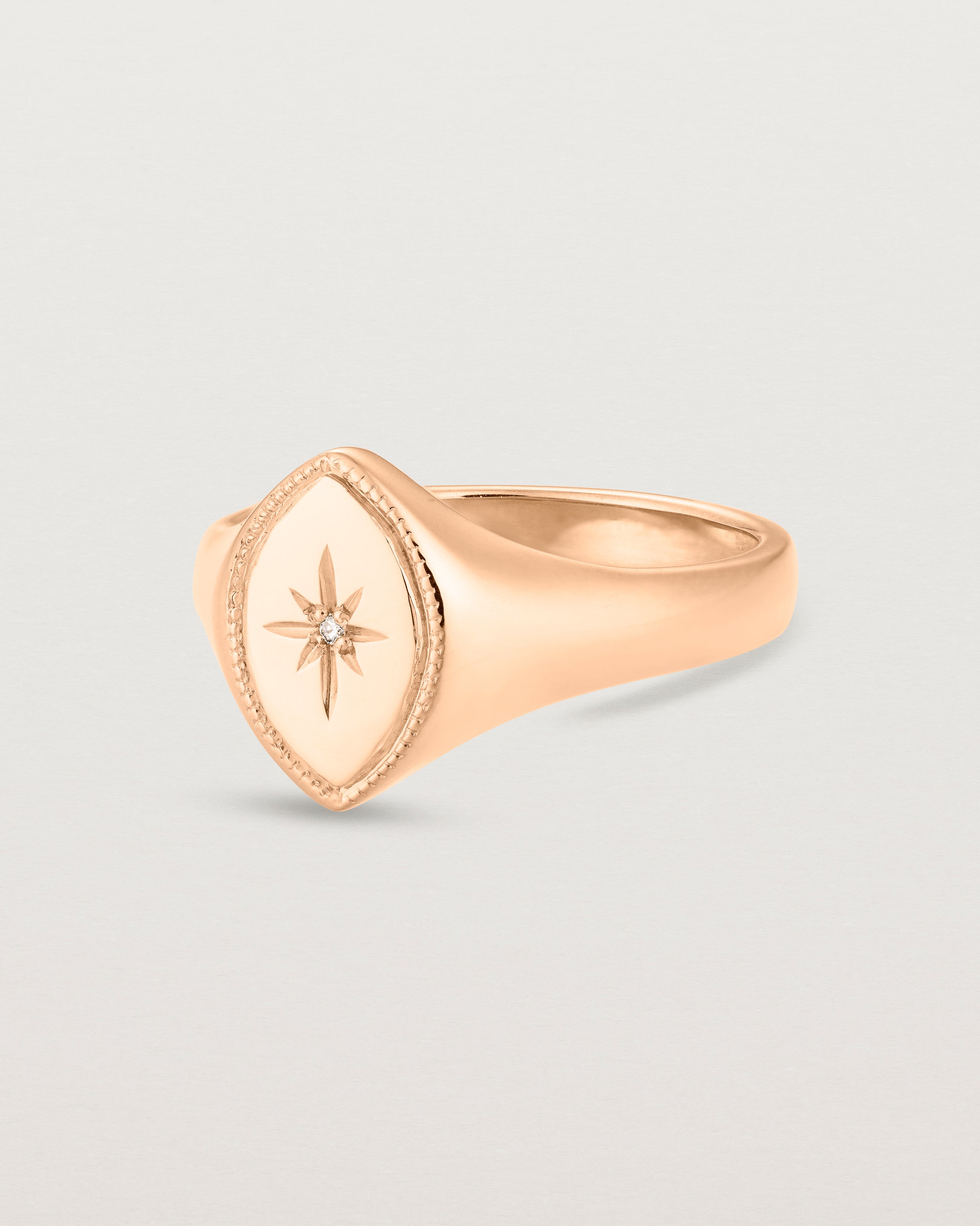 Angled view of the Willow Millgrain Signet Ring | Birthstone in rose gold.