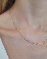 Video of model wearing ember chain necklace in yellow gold.