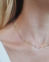 Video of diamond ember necklace being worn in yellow gold