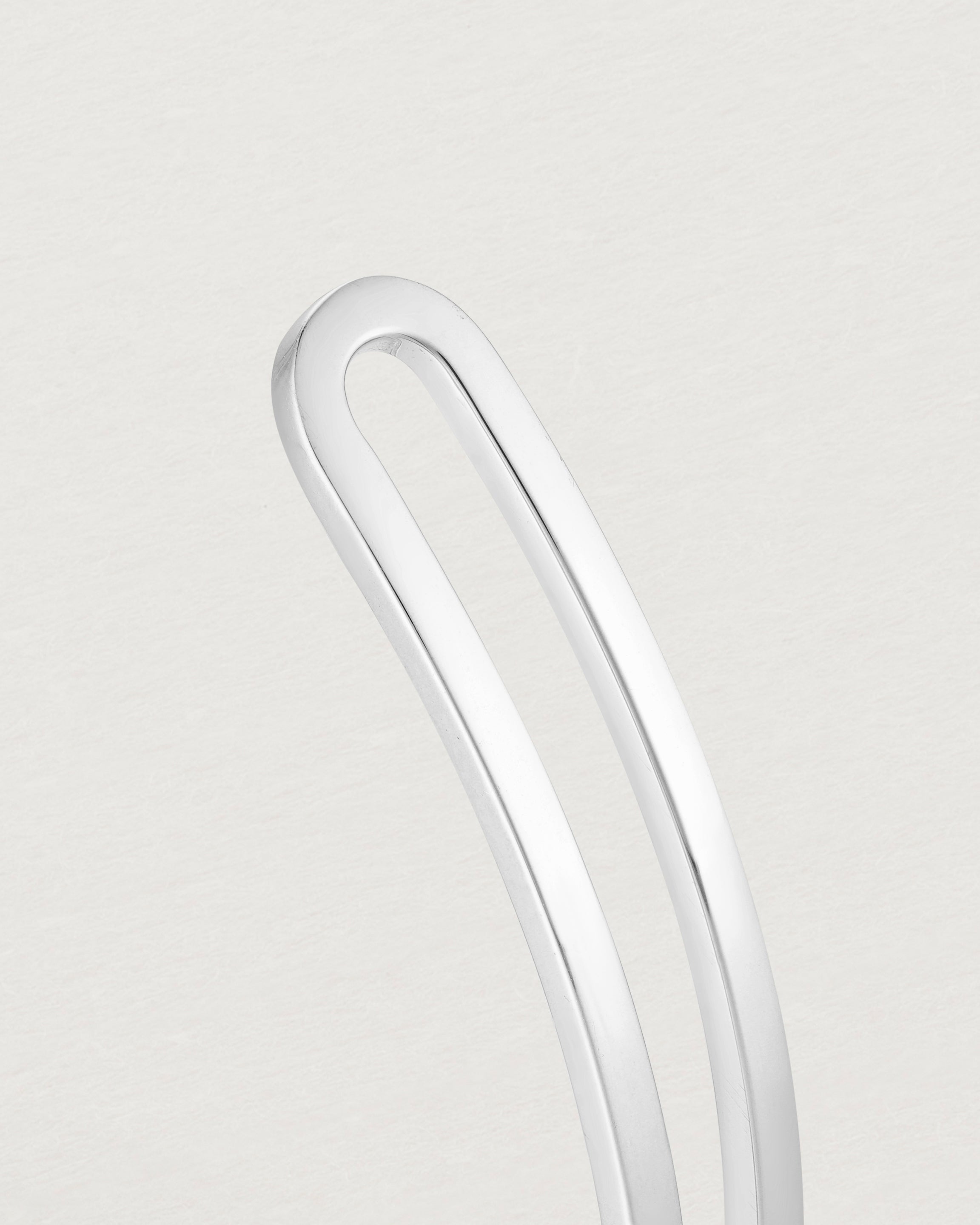 Close up of the detail of the Ailing Cuff Bangle in Sterling Silver.