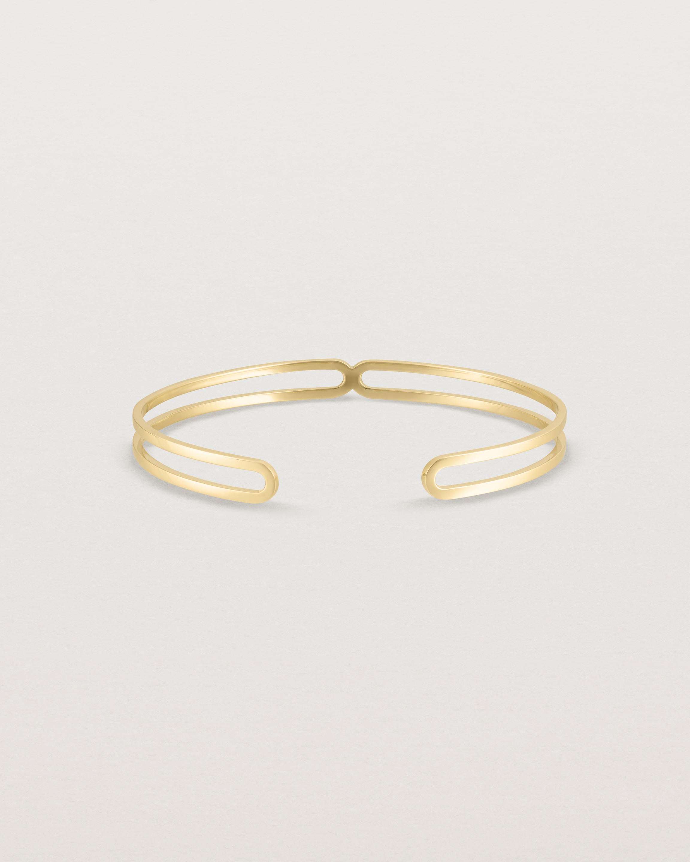 Front view of the Ailing Cuff Bangle in Yellow Gold.