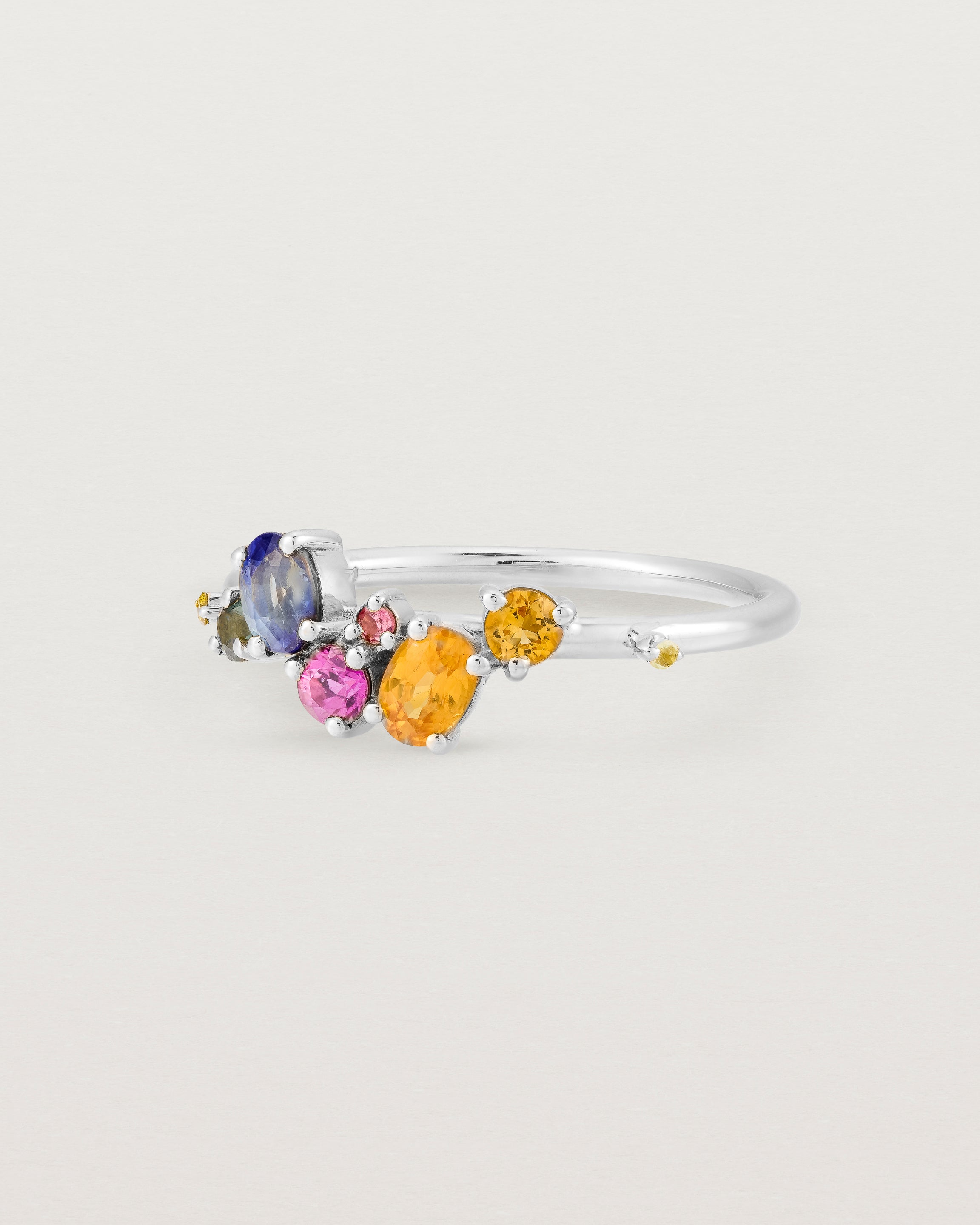 white gold multi coloured precious stone ring