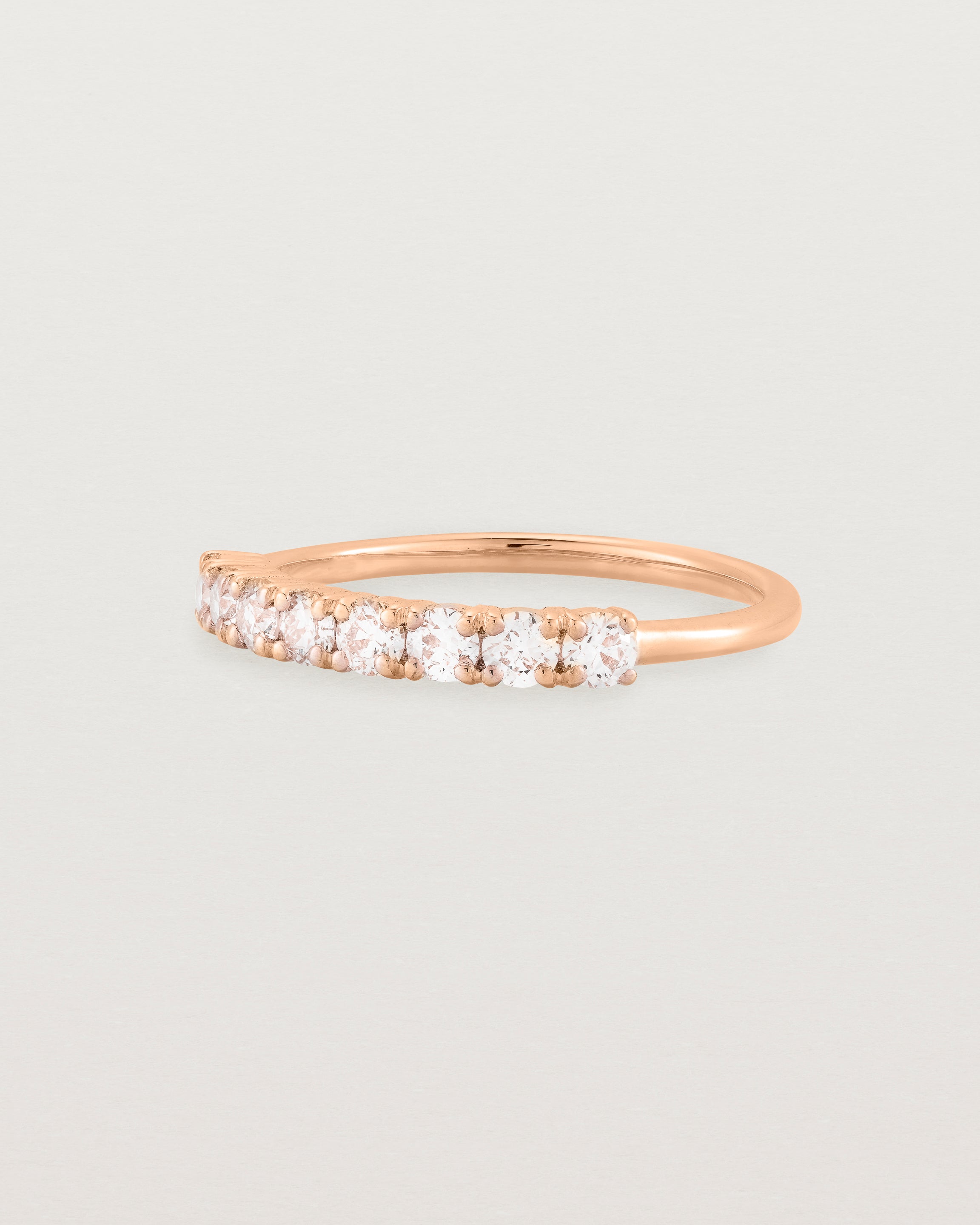 Rose Gold Diamond ring featuring seven white diamonds