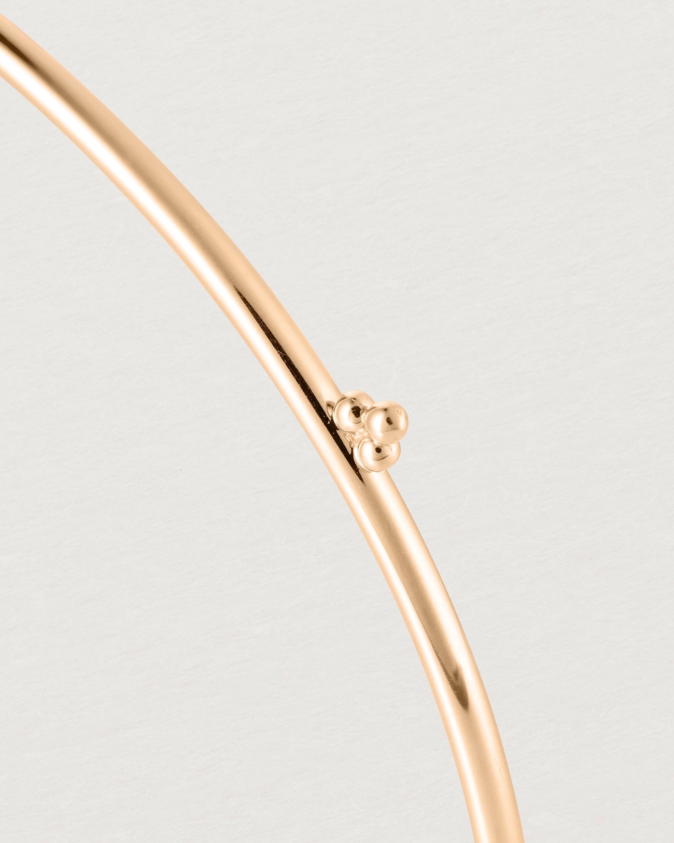 Close up of the detail on the Alya Bangle in Rose Gold.