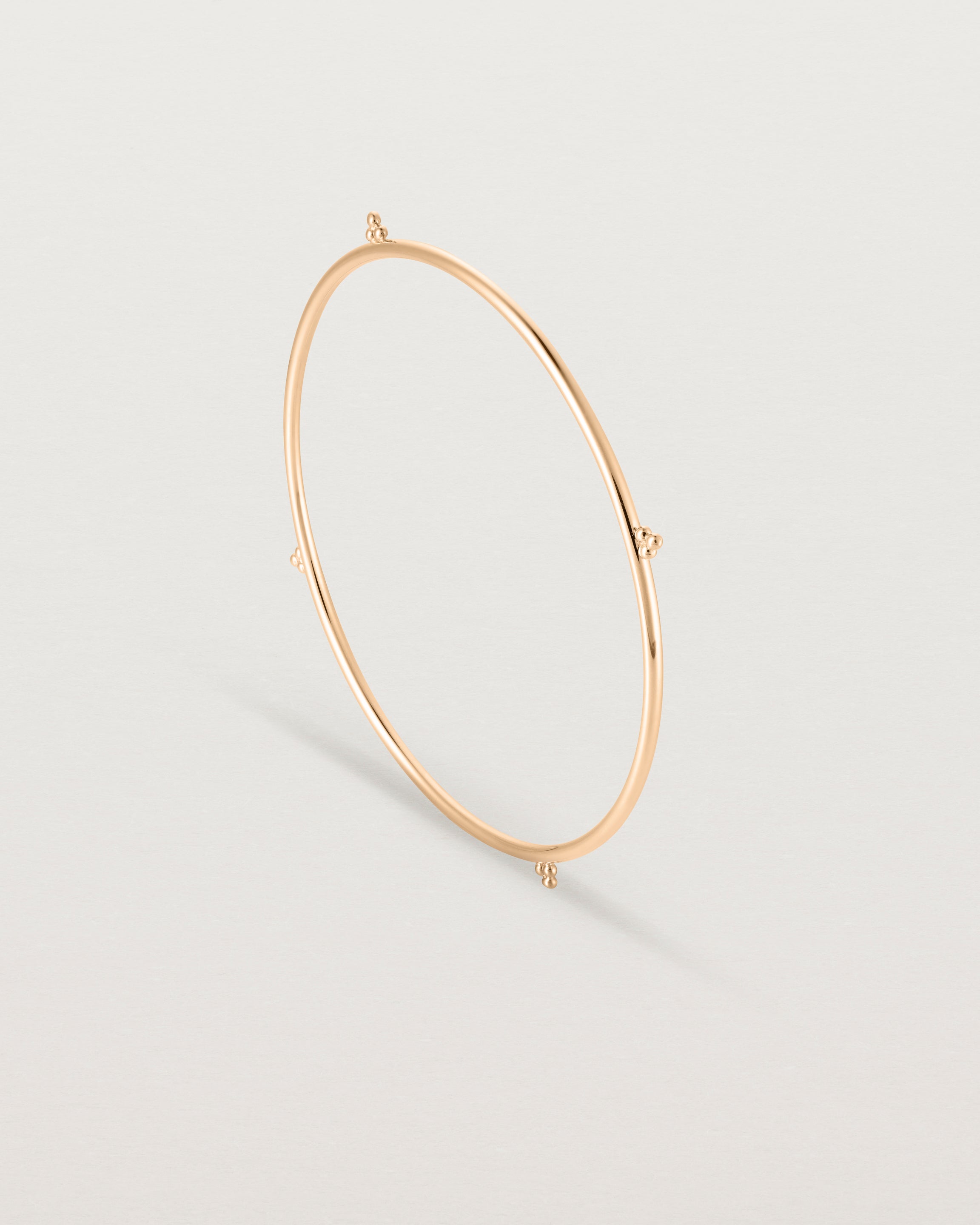 Standing view of the Alya Bangle in Rose Gold.