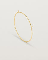 Standing view of the Alya Bangle in Yellow Gold.