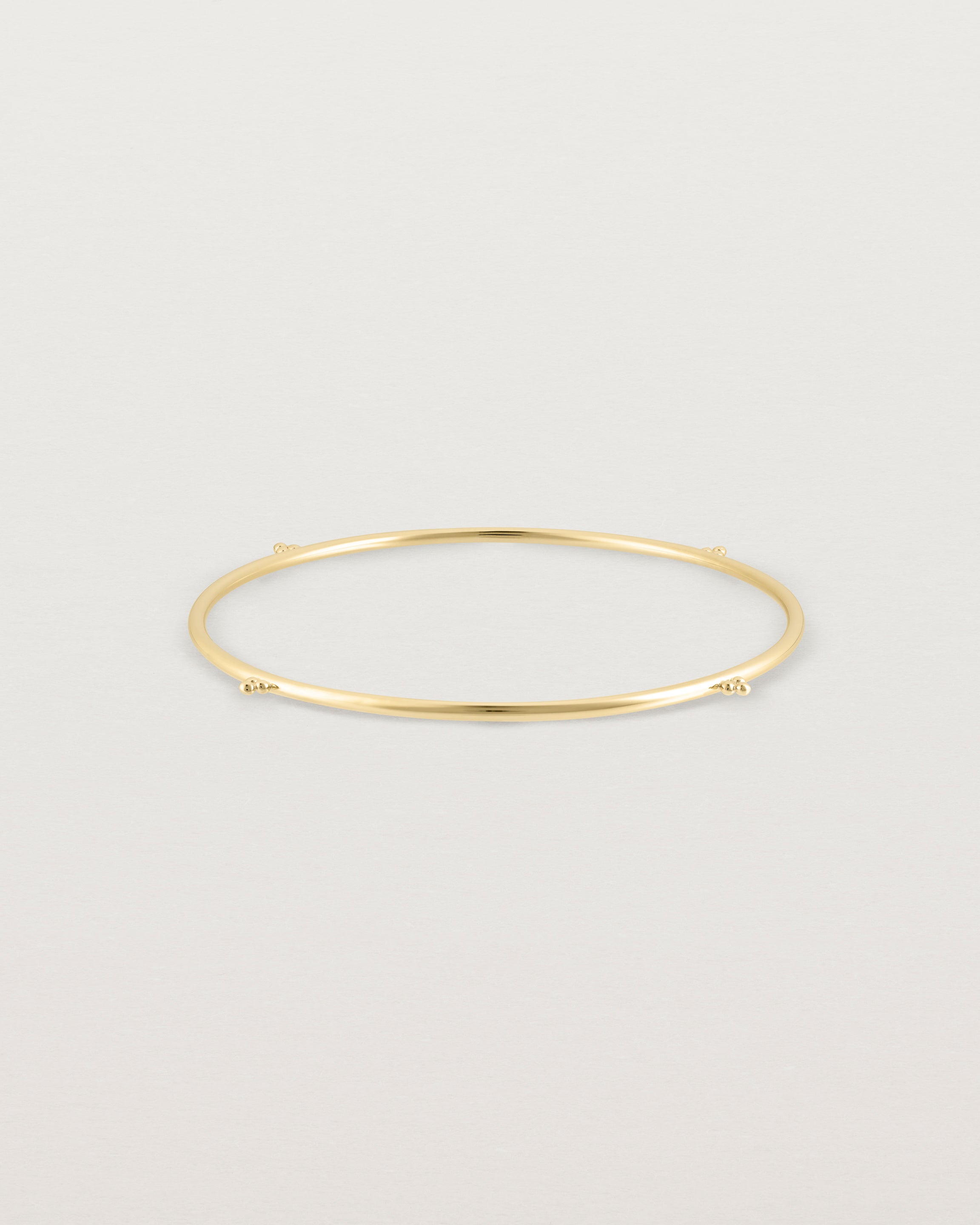 Front view of the Alya Bangle in Yellow Gold.
