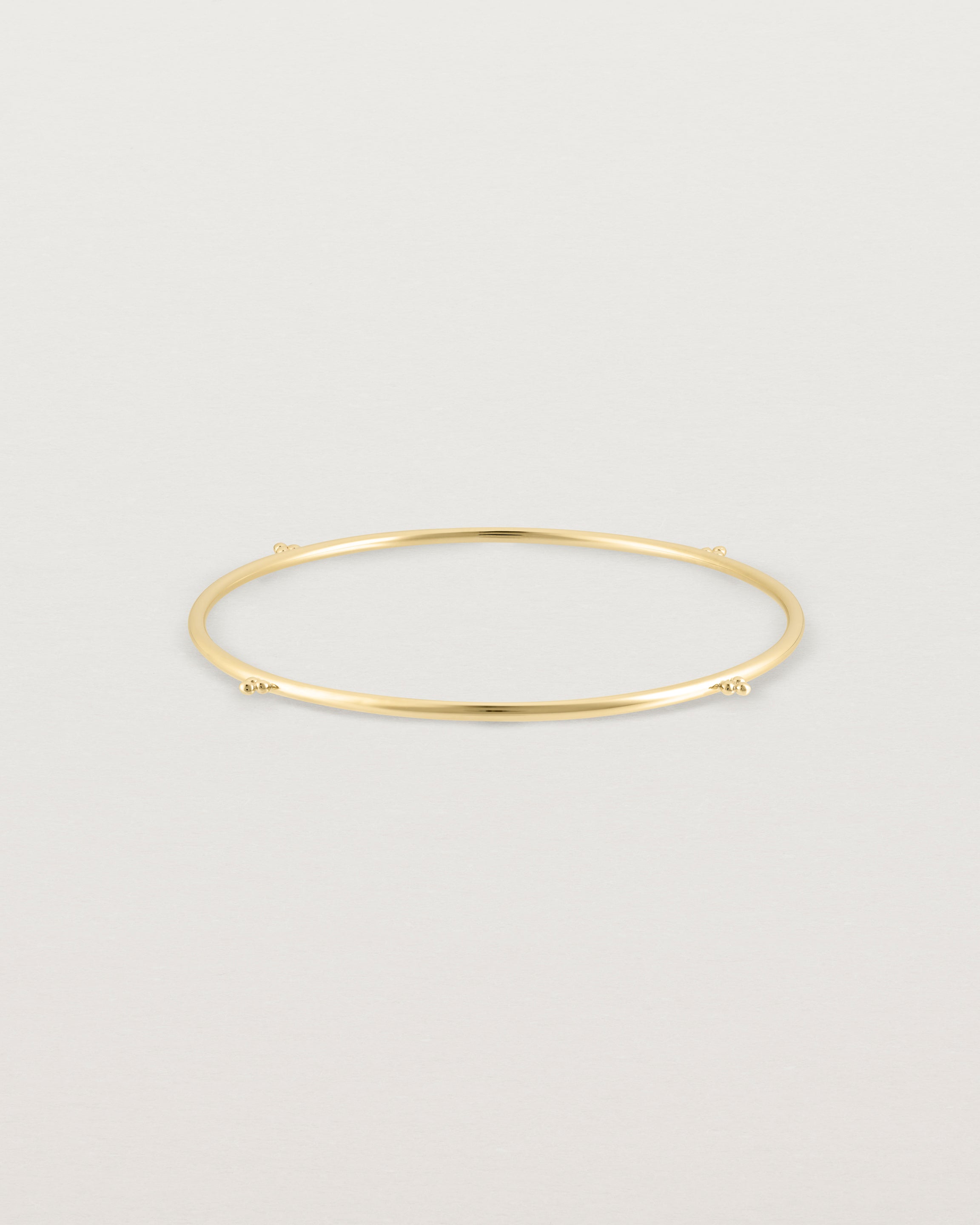 Front view of the Alya Bangle in Yellow Gold.