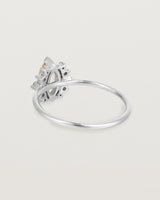 A white gold ring featuring a marquise champagne quartz with a halo of white diamonds