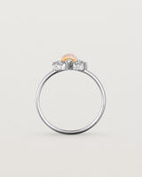 A white gold ring featuring a marquise champagne quartz with a halo of white diamonds
