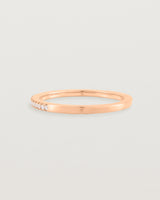 rose gold band with half a band of micro pave diamonds