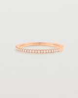 rose gold band with half a band of micro pave diamonds