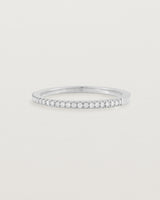 white gold band with half a band of micro pave diamonds