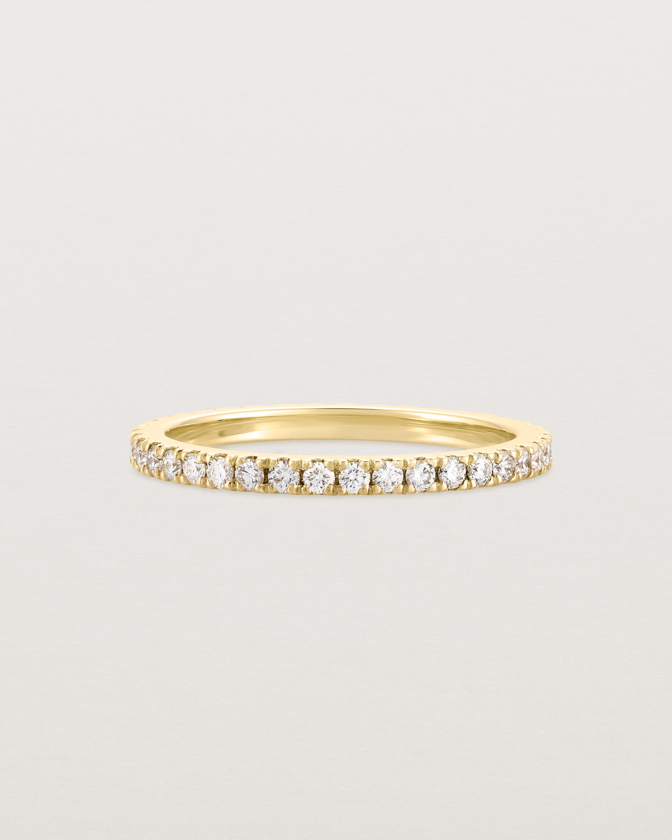A gold ring with white diamonds