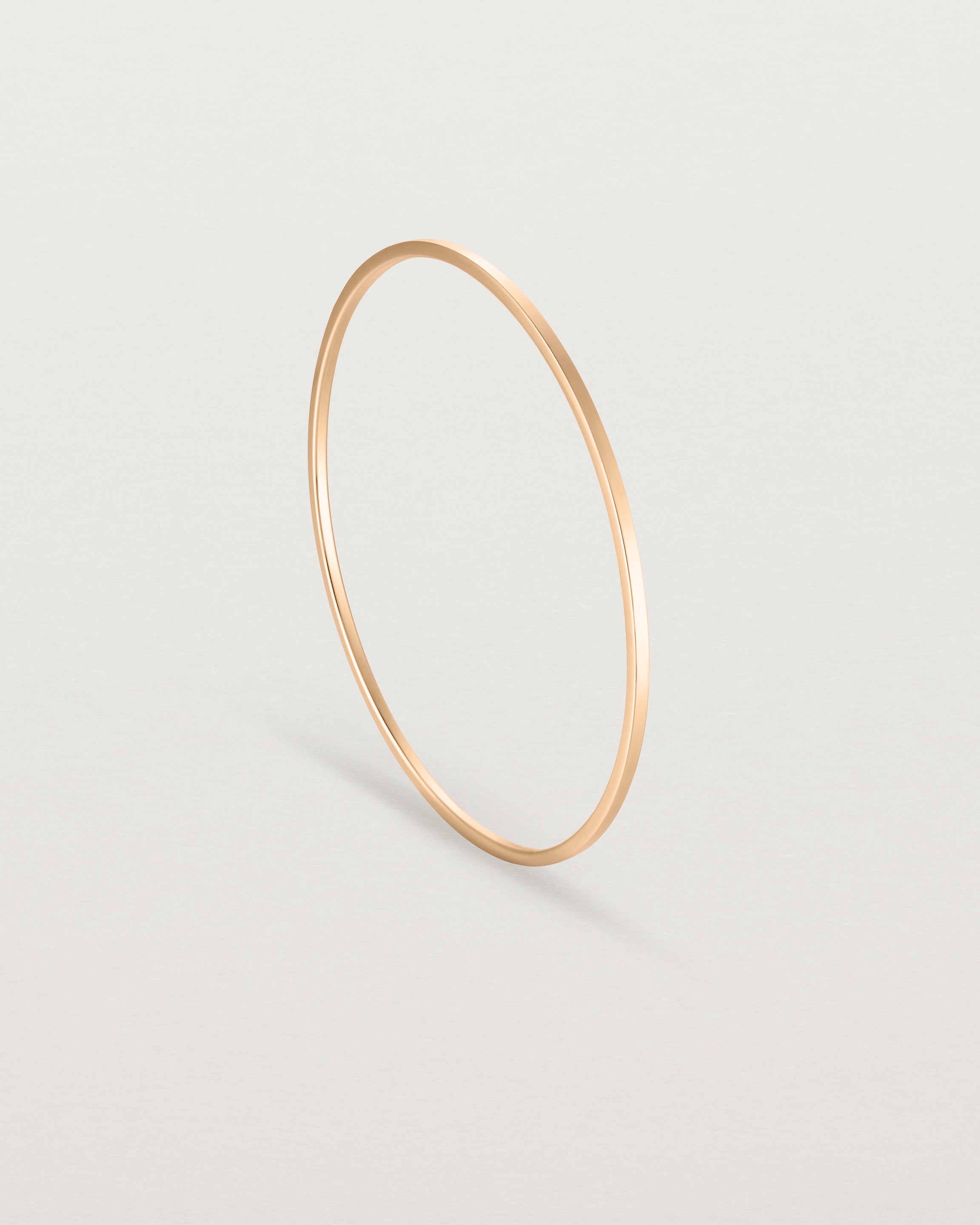 Standing view of the Antares Bangle in Rose Gold.