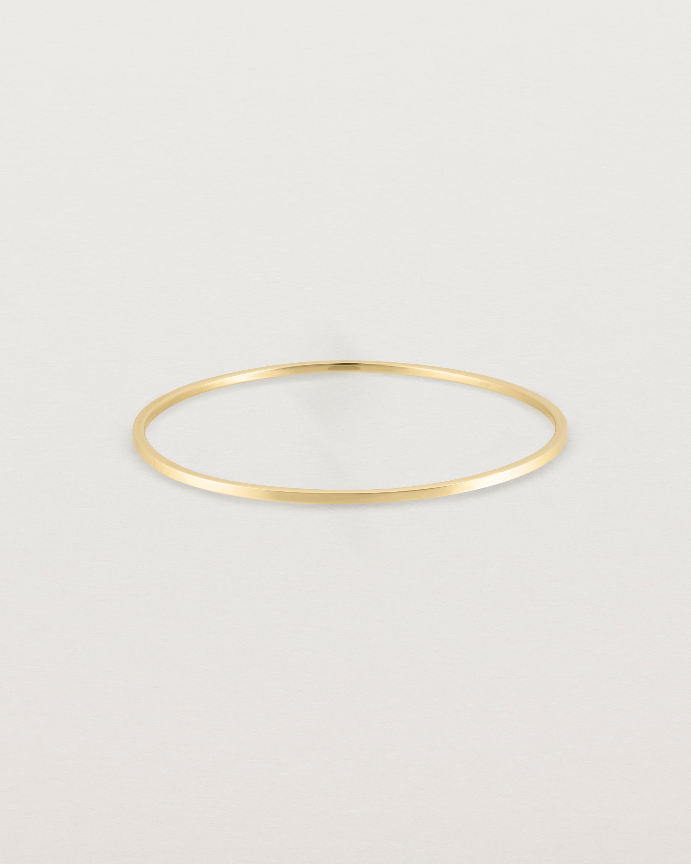 Front view of the Antares Bangle in Yellow Gold.