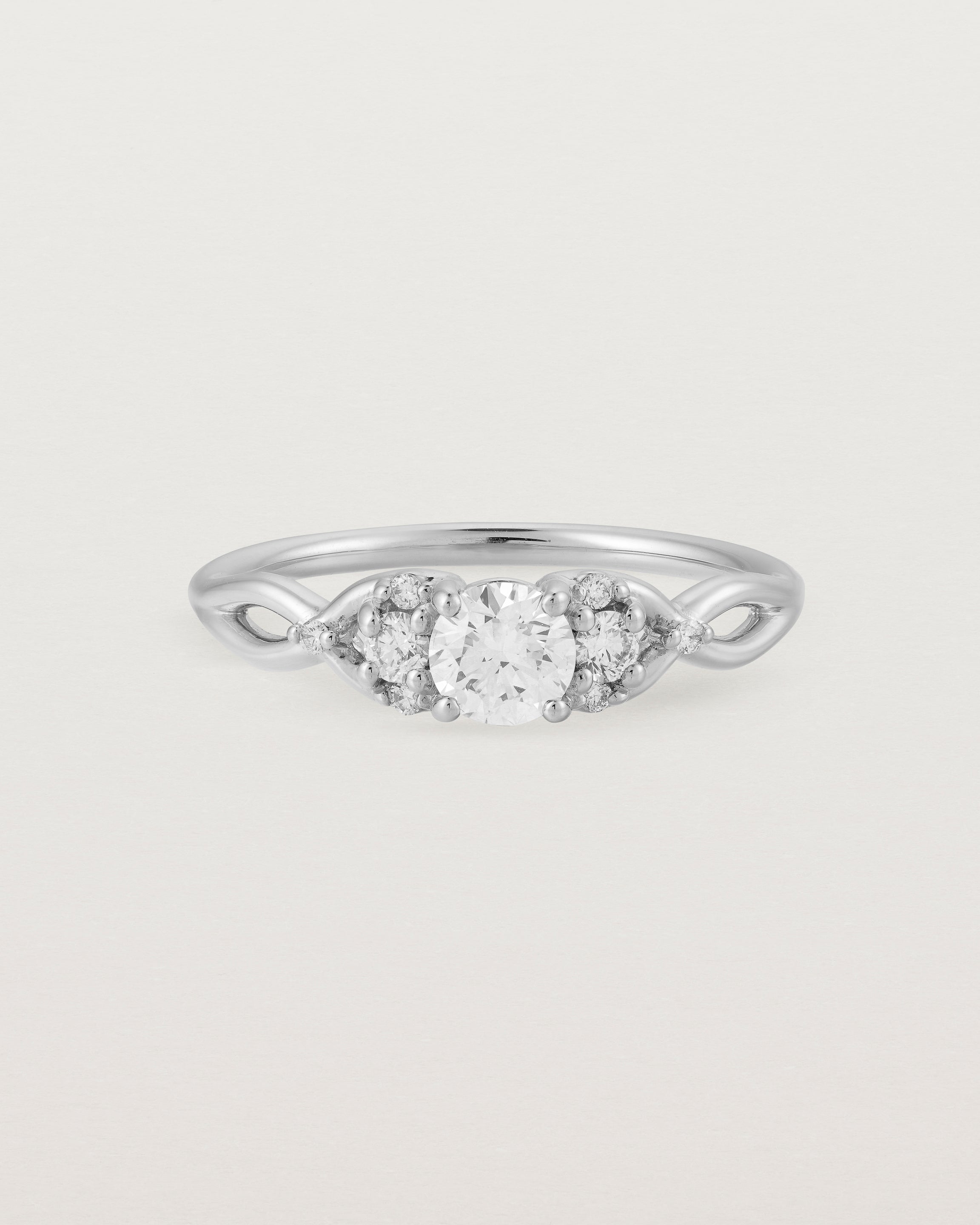 A vintage inspired white gold ring featuring white diamonds