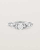 A vintage inspired white gold ring featuring white diamonds