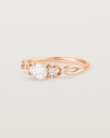 A vintage inspired rose gold ring featuring white diamonds
