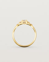 A vintage inspired yellow gold ring featuring white diamonds