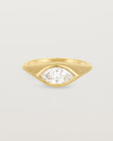 A yellow gold Signet Ring featuring a marquise cut white diamond