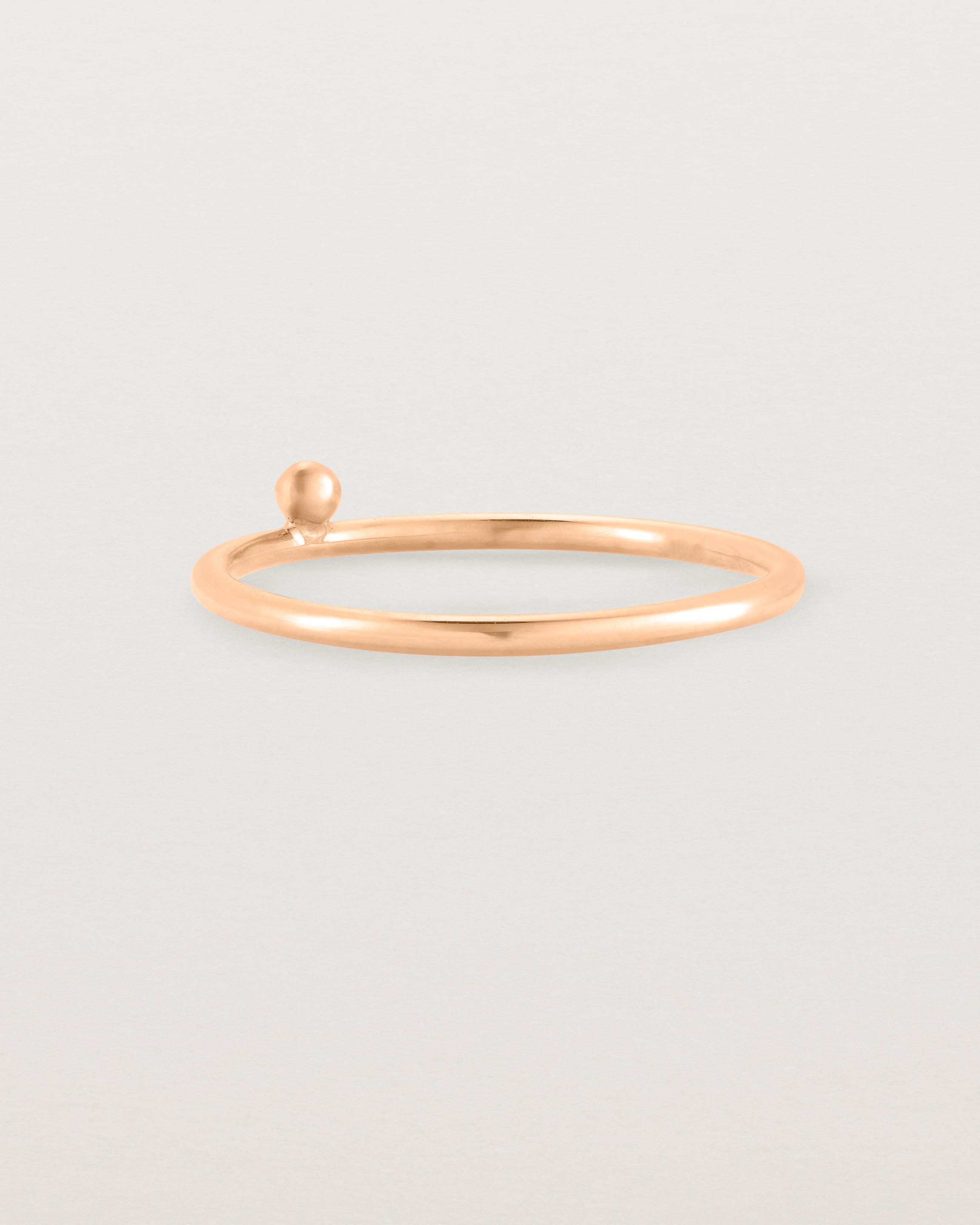 rose gold fine ring with a single dot detail