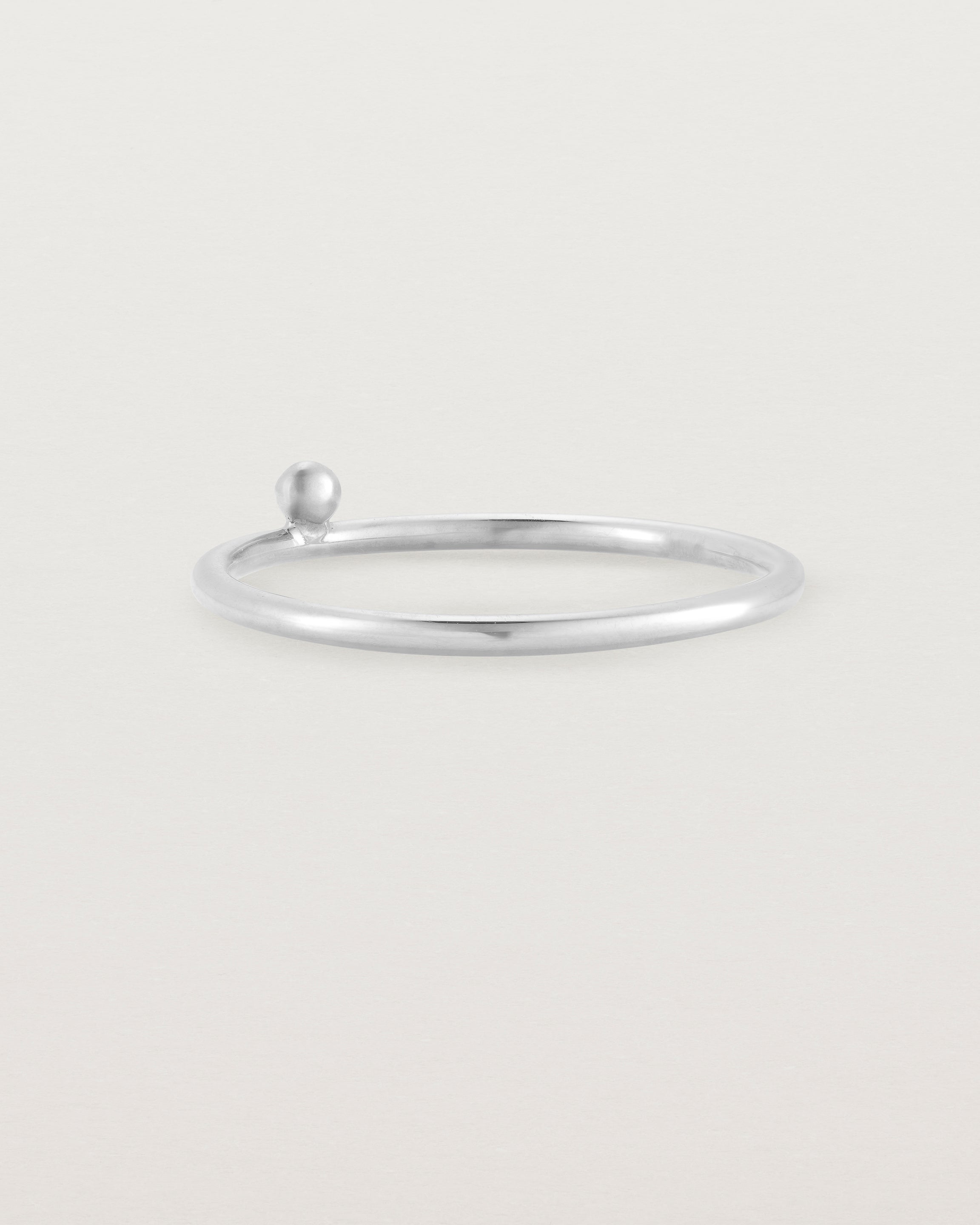Silver fine ring with a single dot detail