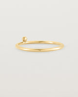 yellow gold fine ring with a single dot detail