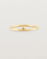 yellow gold fine ring with a single dot detail