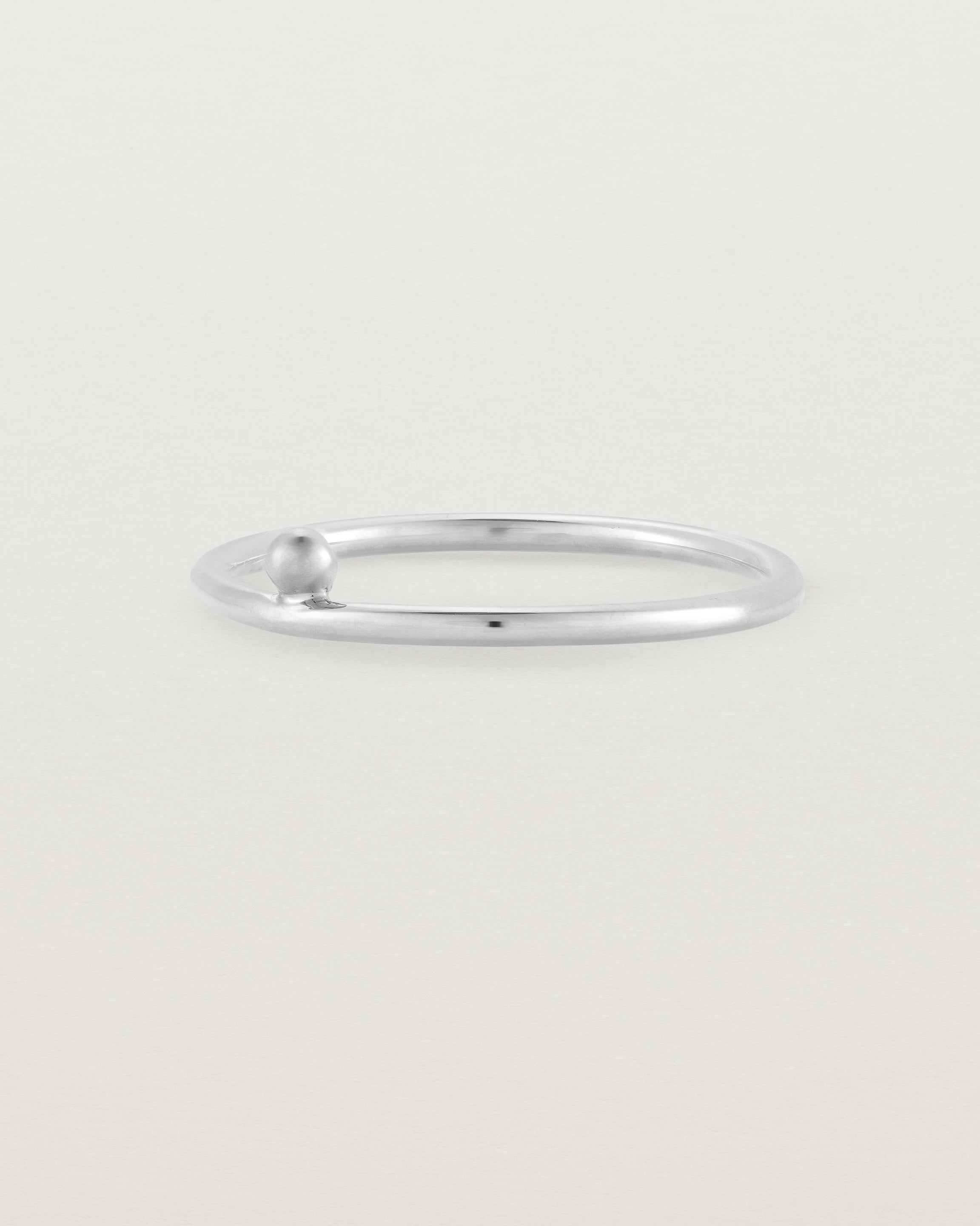 Silver fine ring with a single dot detail