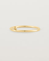 yellow gold fine ring with a single dot detail