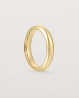 Standing view of the Bold Curve Ring | 4mm | Yellow Gold.