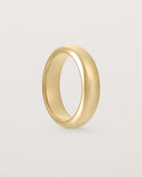 Standing view of the Bold Curve Ring | 6mm | Yellow Gold.
