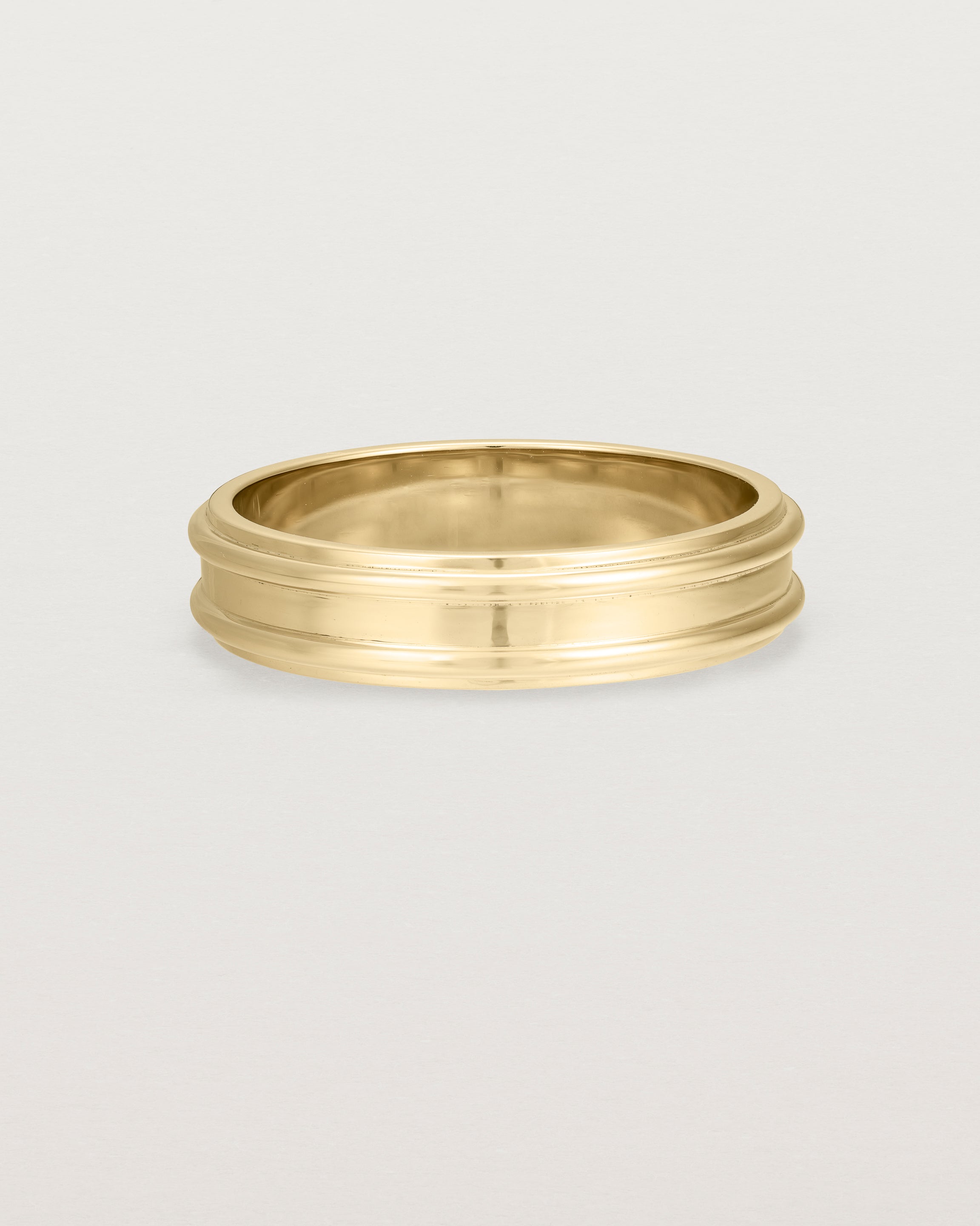 Front view of the Border Wedding Ring | 5mm | Yellow Gold.