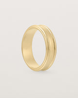 Standing view of the Border Wedding Ring | 6mm | Yellow Gold.