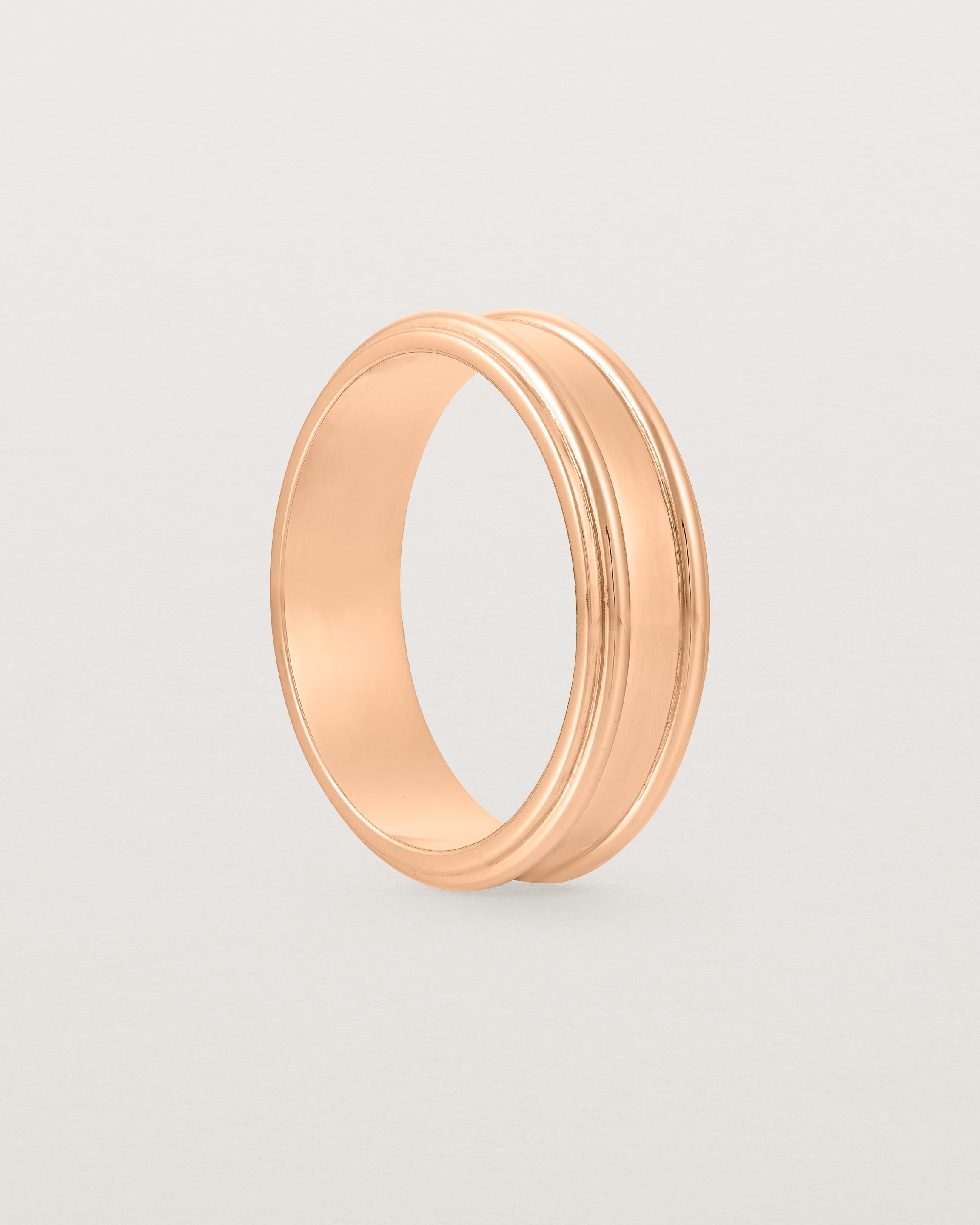 Standing view of the Border Wedding Ring | 6mm | Rose Gold.