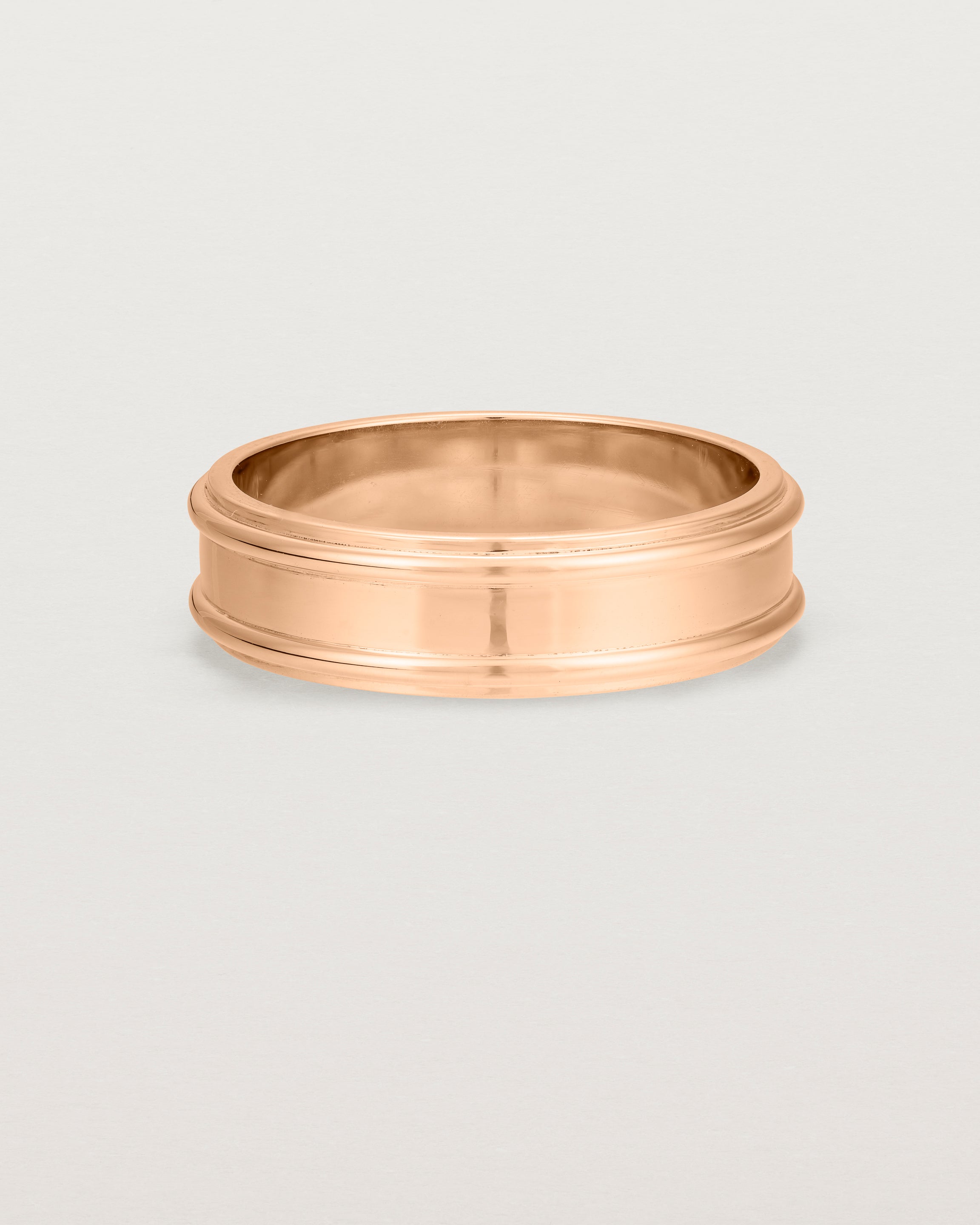 Front view of the Border Wedding Ring | 6mm | Rose Gold.