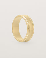 Standing view of the Border Wedding Ring | 7mm | Yellow Gold.