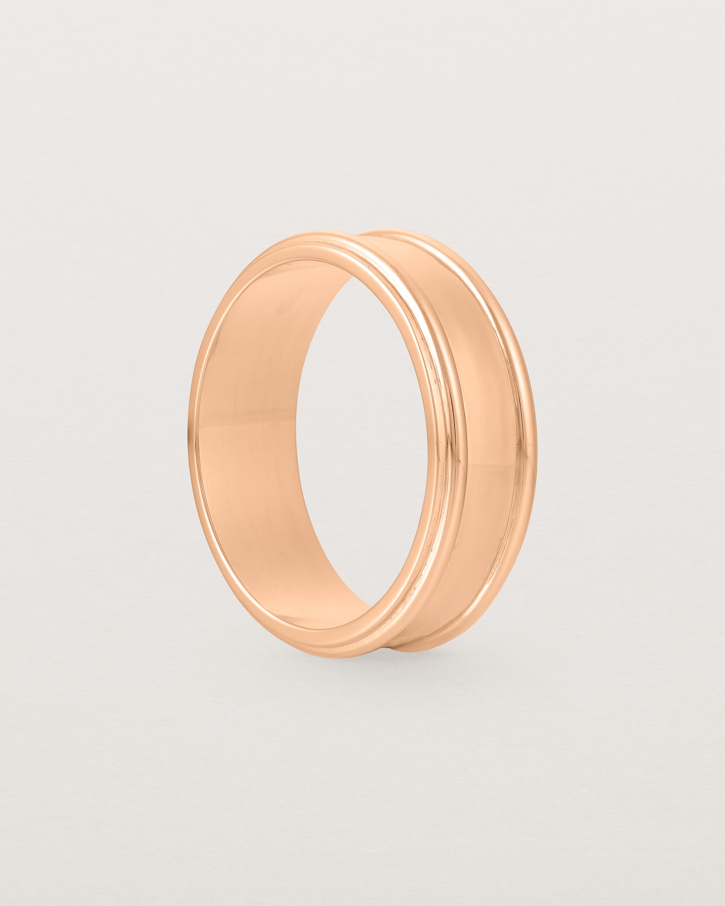 Standing view of the Border Wedding Ring | 7mm | Rose Gold.