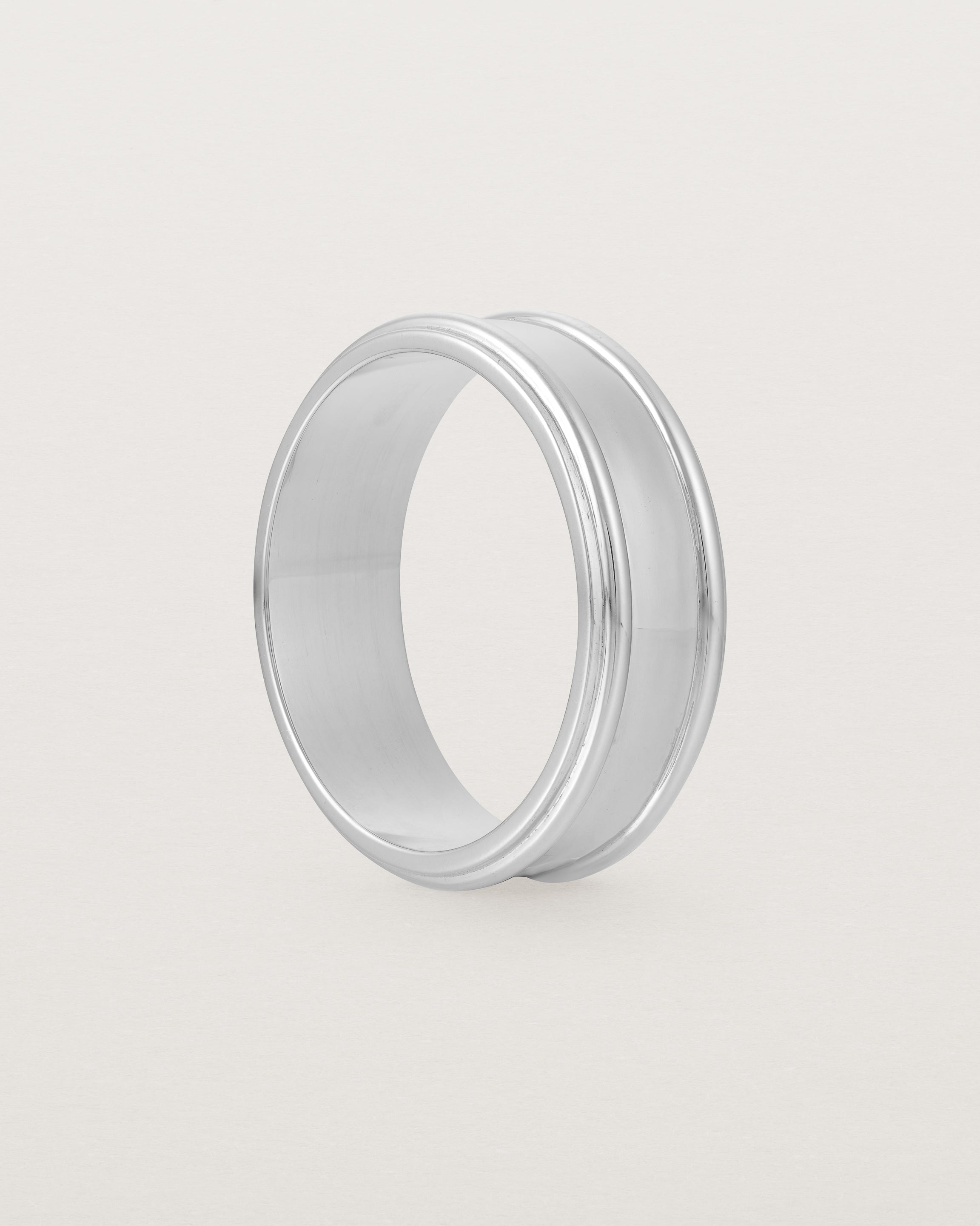 Standing view of the Border Wedding Ring | 7mm | White Gold.