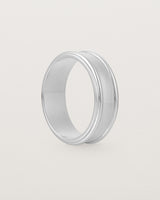 Standing view of the Border Wedding Ring | 7mm | White Gold.