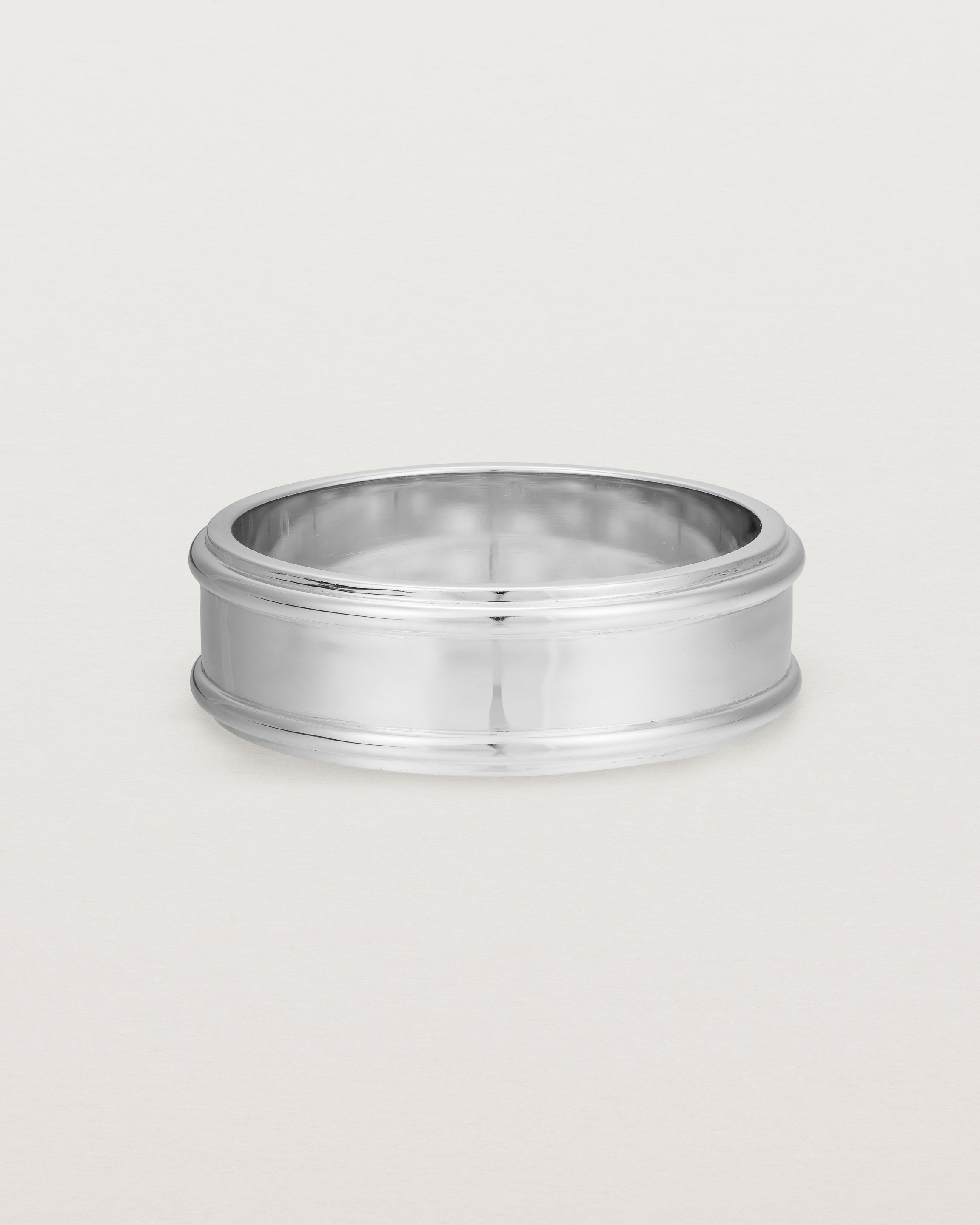 Front view of the Border Wedding Ring | 7mm | White Gold.