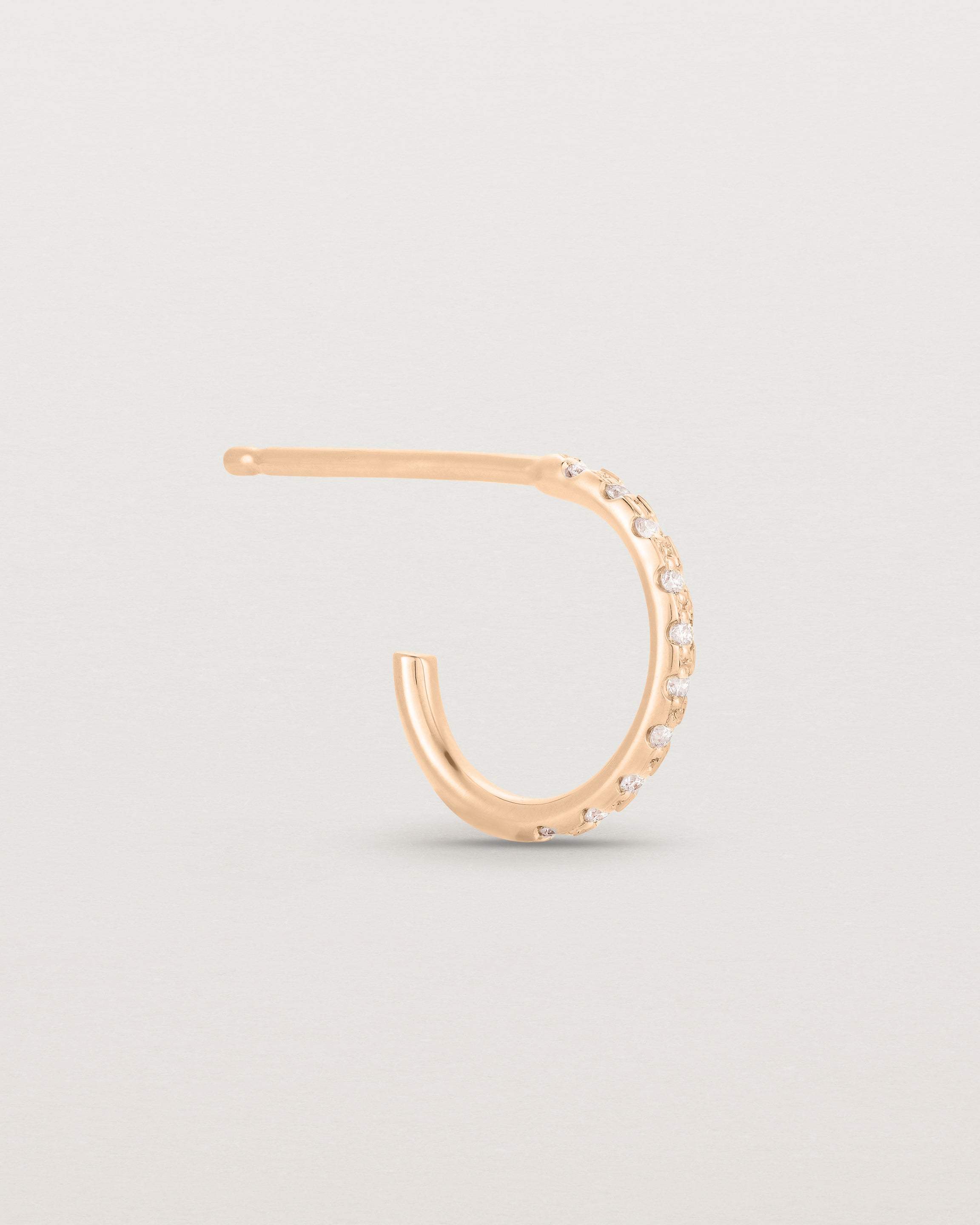 A single of the Cascade Hoops | Diamonds | Rose Gold