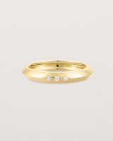 yellow gold band with three white diamonds