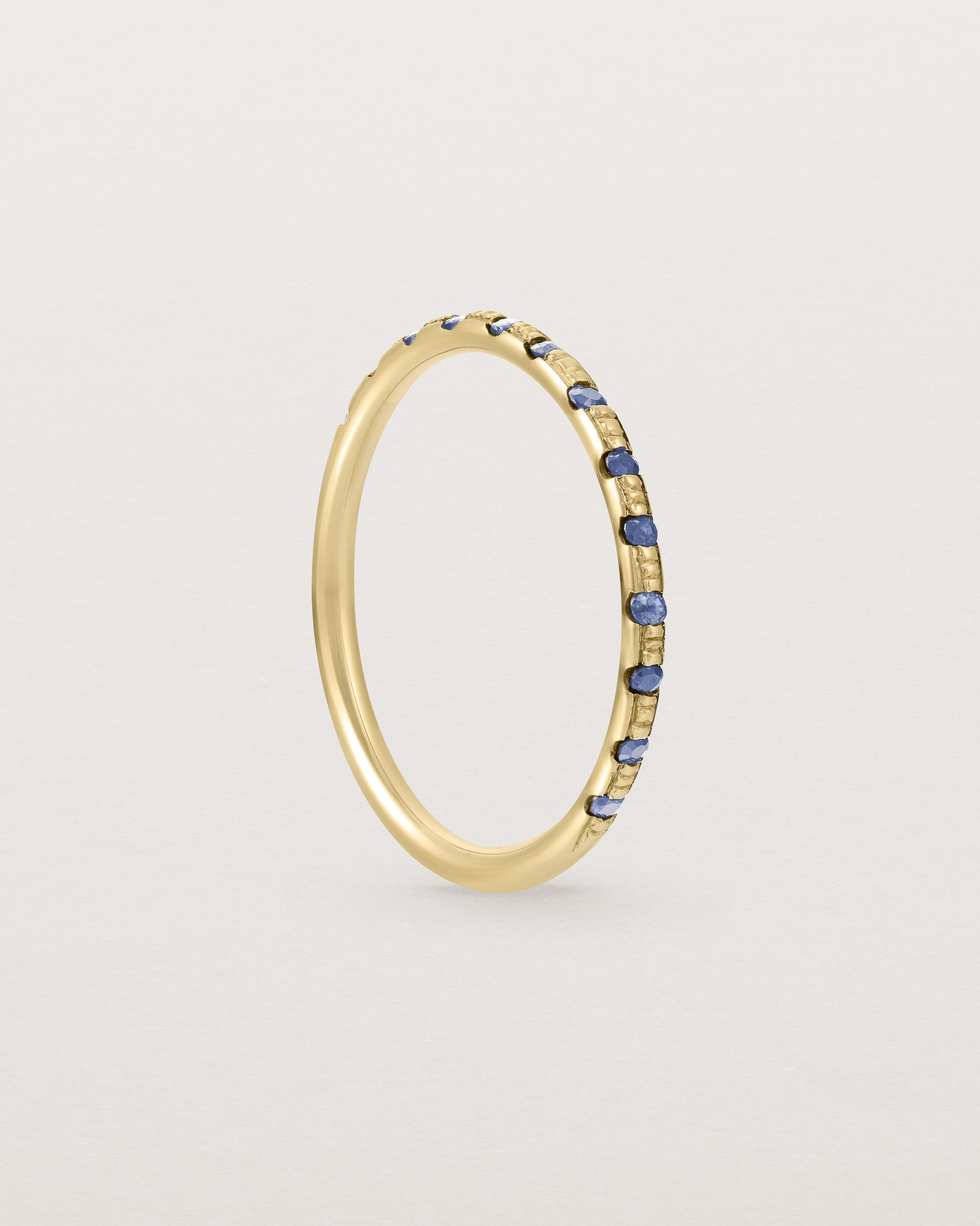 Standing View of Cascade Round Profile Wedding Ring | Sapphire | Yellow Gold 