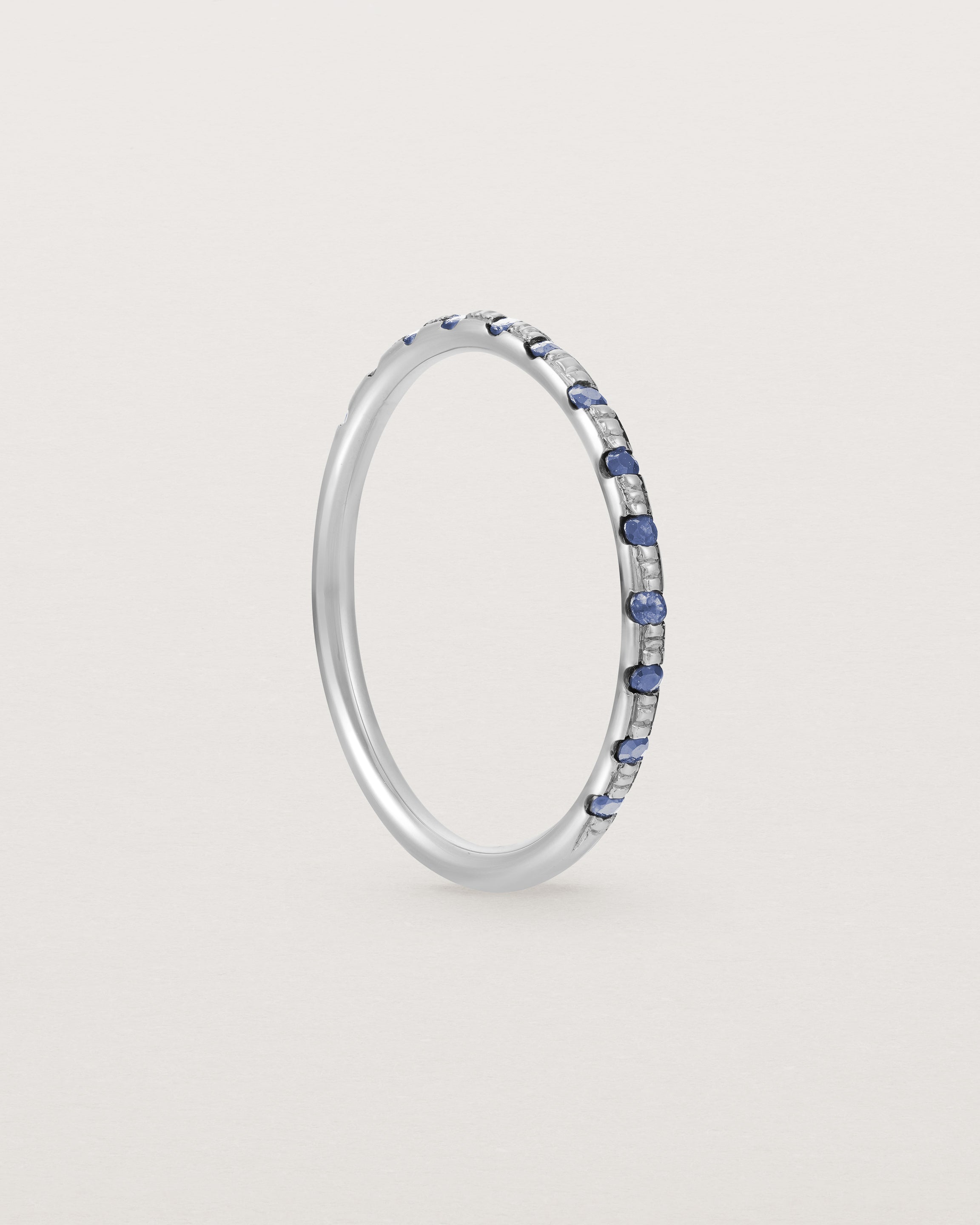 Standing View of Cascade Round Profile Wedding Ring | Sapphire | White Gold 