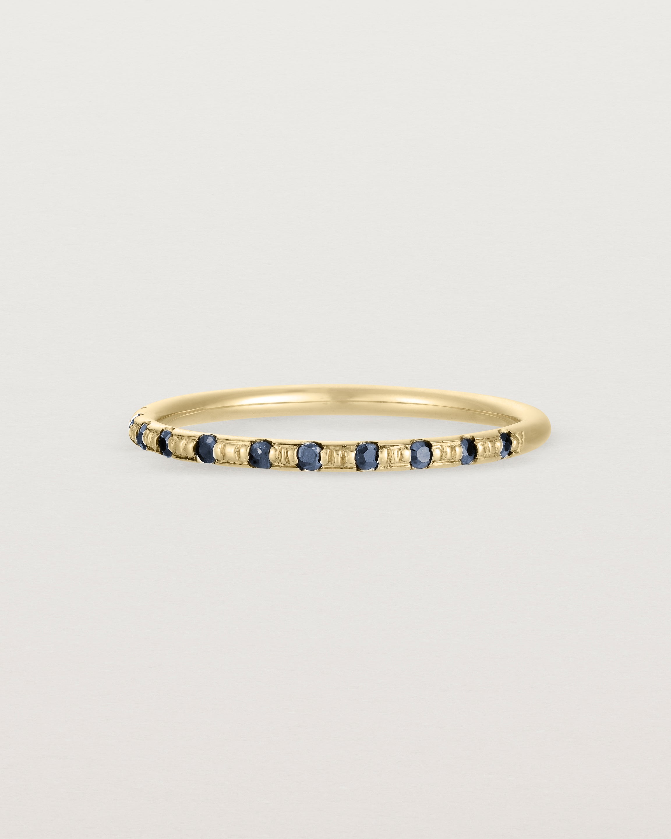 Side View of Cascade Round Profile Wedding Ring | Sapphire | Yellow Gold 