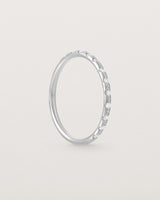 Angled View of Cascade Round Profile Wedding Ring | Diamonds | White Gold